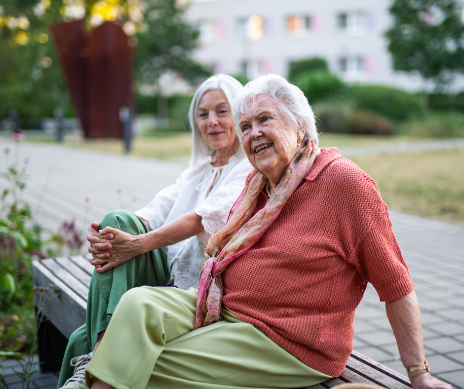 Adult daughter having a supportive conversation with her mother about senior living in Boca Raton