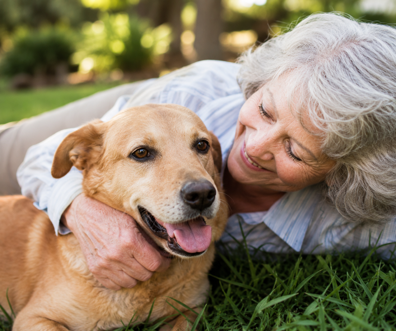 Older woman embracing her dog outdoors at a senior living community in Boynton Beach, Florida