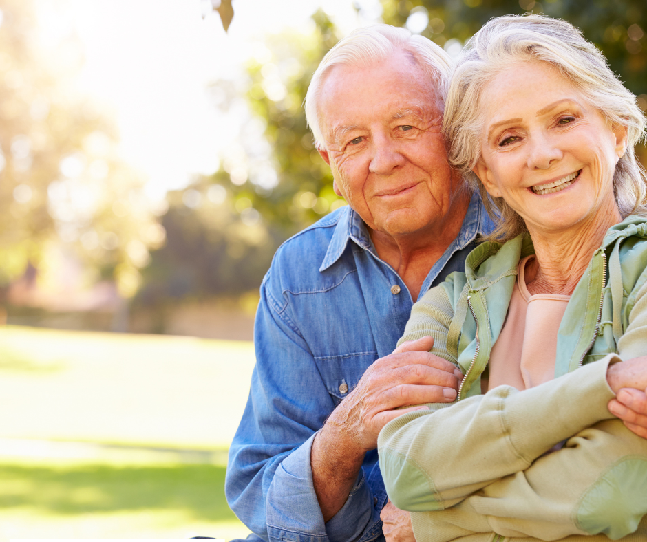Smiling older couple outdoors representing senior living in Delray Beach, Florida
